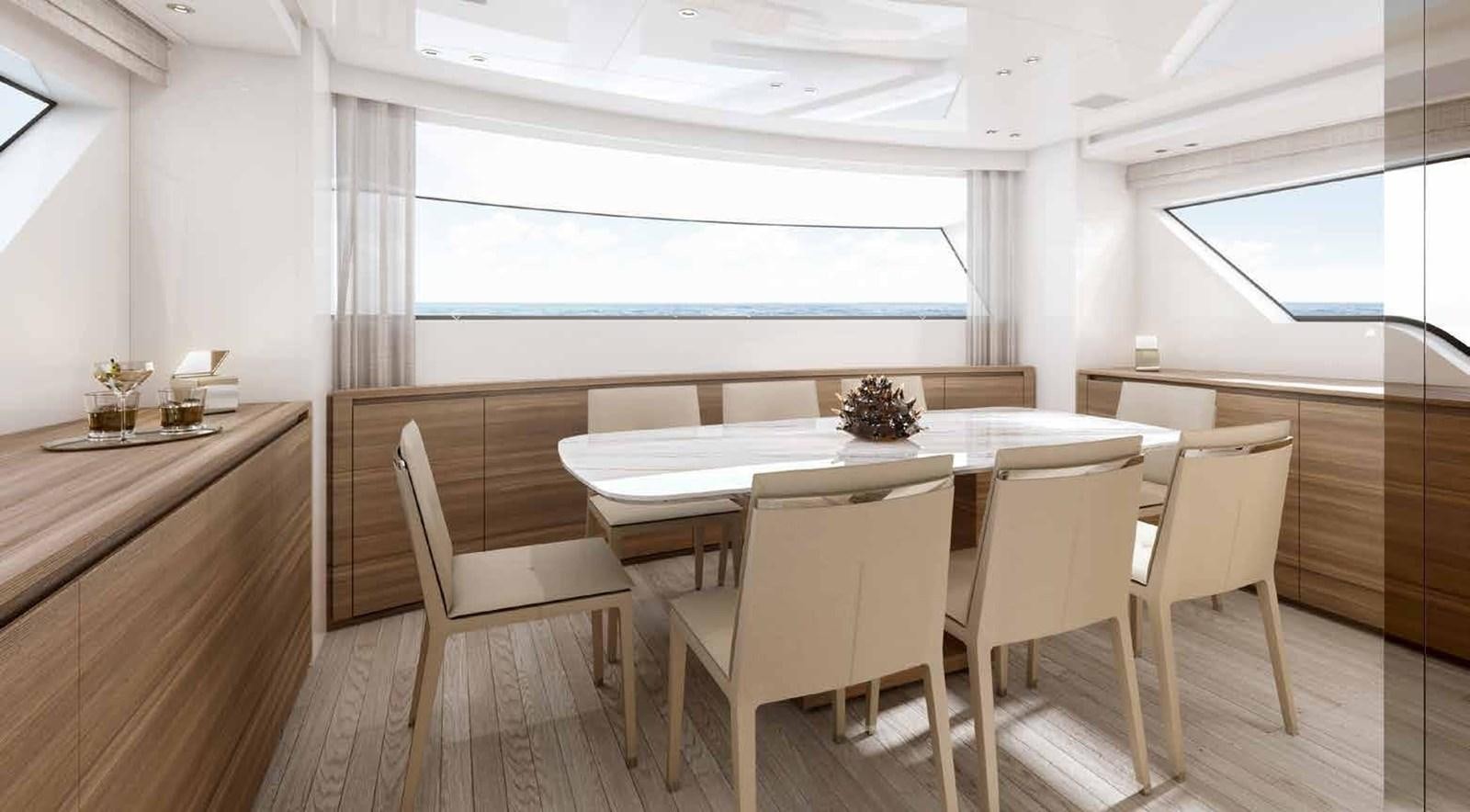 a dining table and chairs in a room aboard OMNIA Yacht for Sale