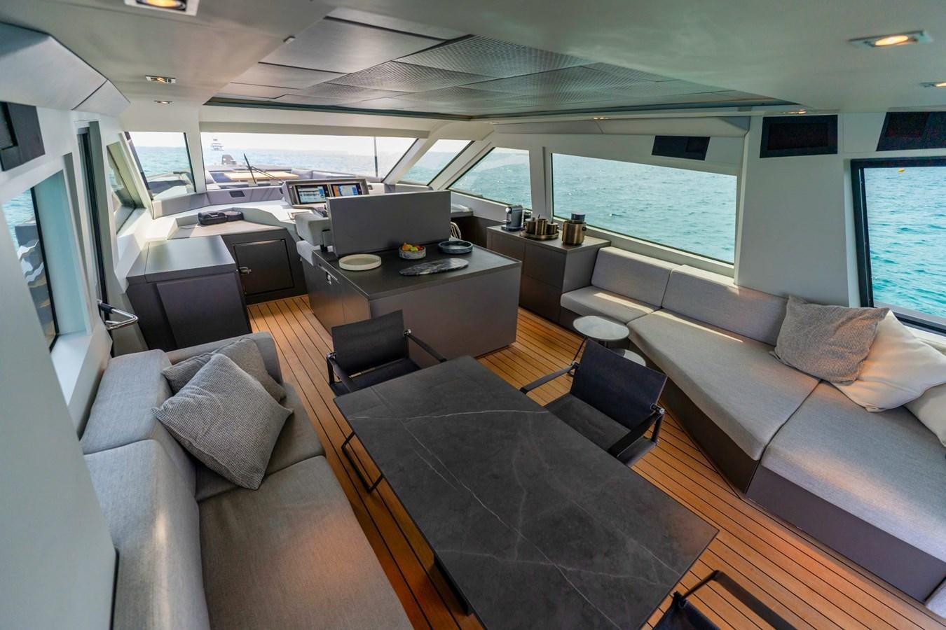 a living room with a couch and a table aboard FINEZZA Yacht for Sale