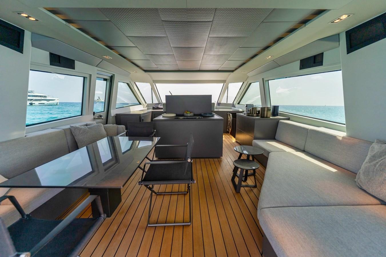 a room with a couch and a table and chairs aboard FINEZZA Yacht for Sale
