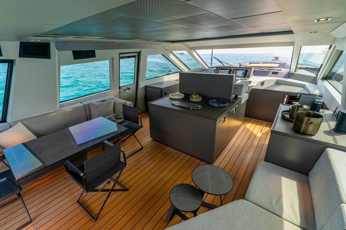 a room with a table and chairs aboard FINEZZA Yacht for Sale