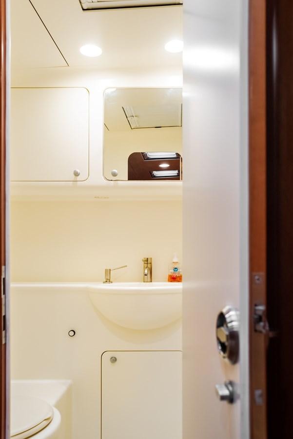 a bathroom with a sink and a mirror aboard MISTER A Yacht for Sale