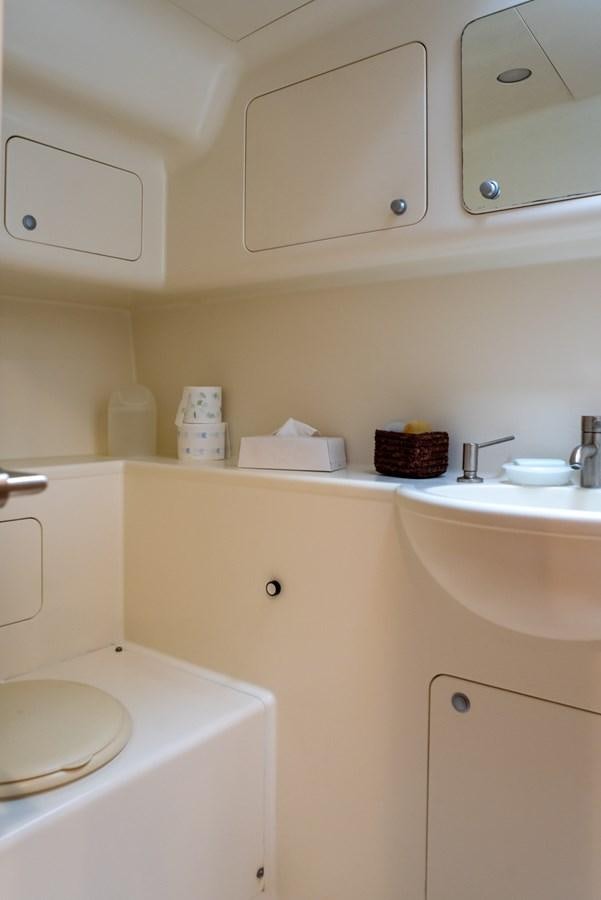 a kitchen with a sink and a microwave aboard MISTER A Yacht for Sale