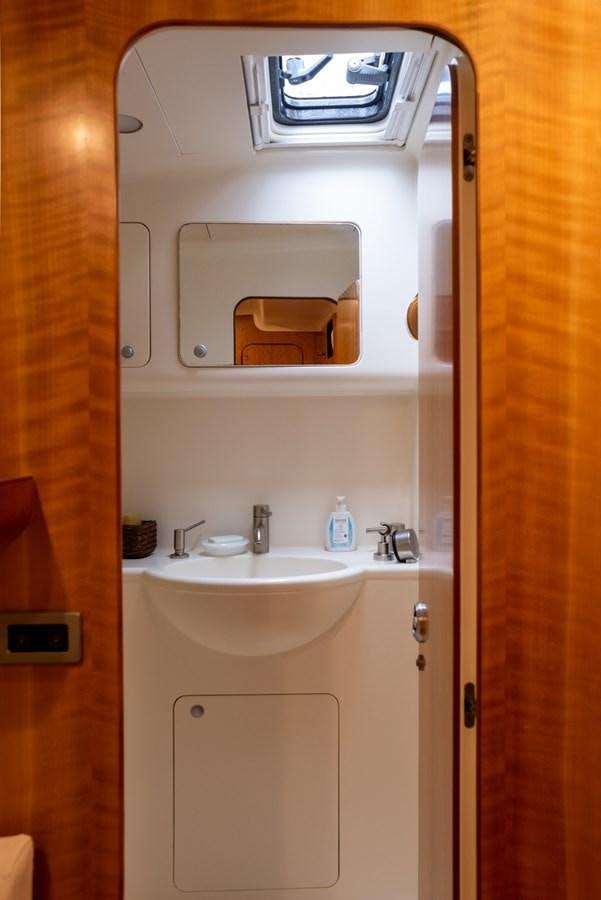 a bathroom with a sink and a mirror aboard MISTER A Yacht for Sale