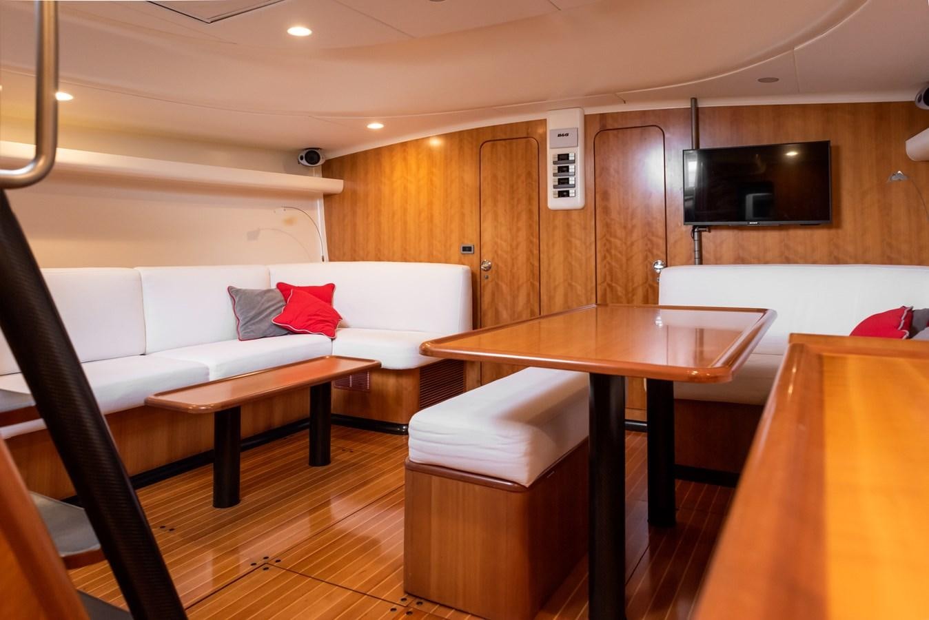 a living room with a couch and a table aboard MISTER A Yacht for Sale