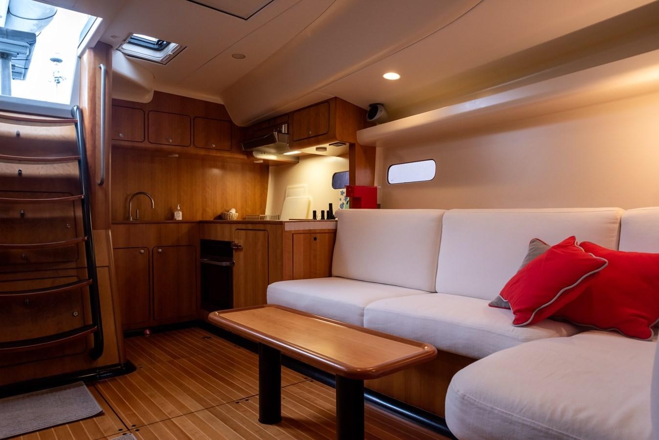 a living room with a wood cabinet aboard MISTER A Yacht for Sale