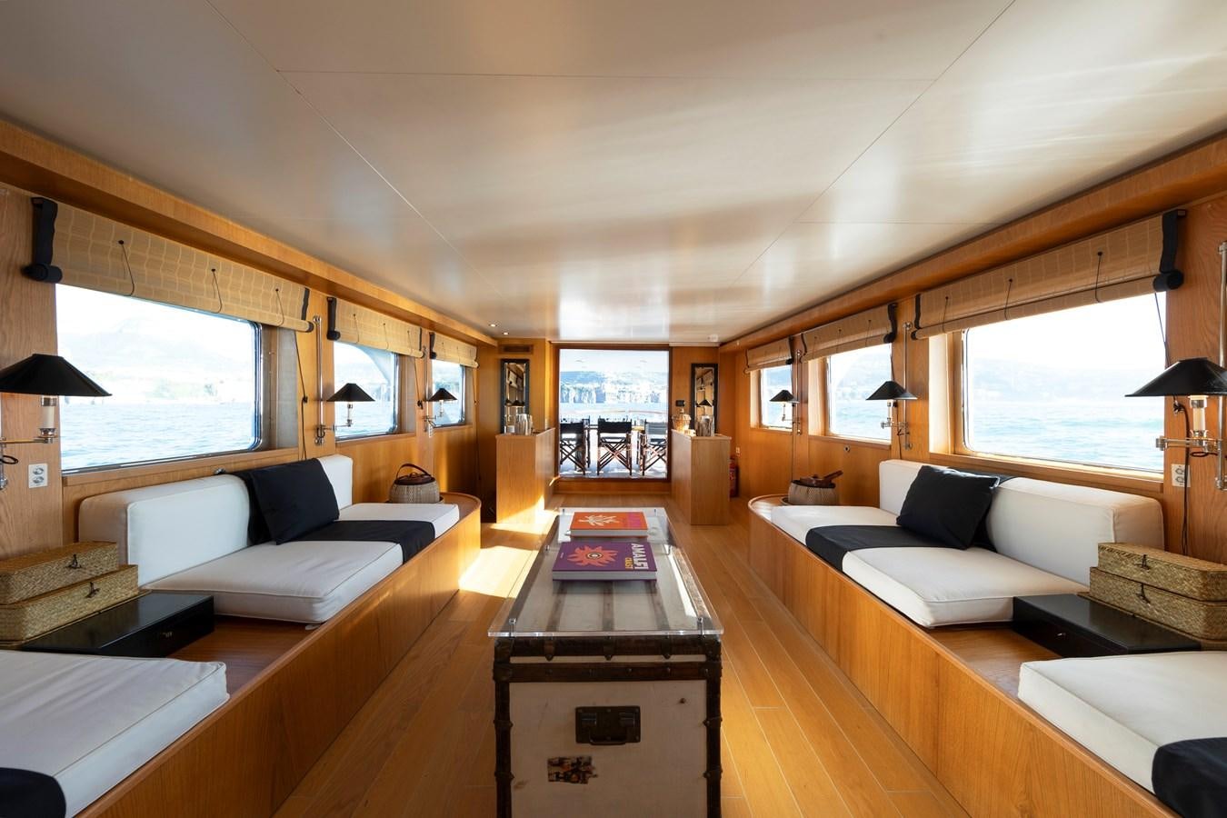 a room with a couch and a table and a bed aboard SOUNION II Yacht for Sale