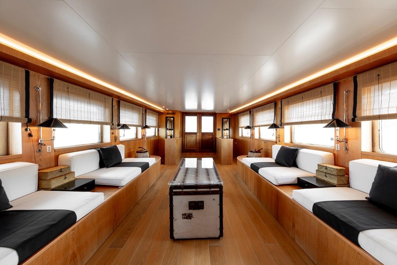 a room with a bed and a couch aboard SOUNION II Yacht for Sale