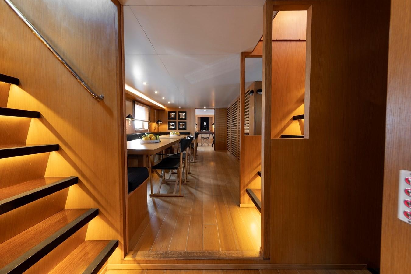 a room with a table and chairs aboard SOUNION II Yacht for Sale