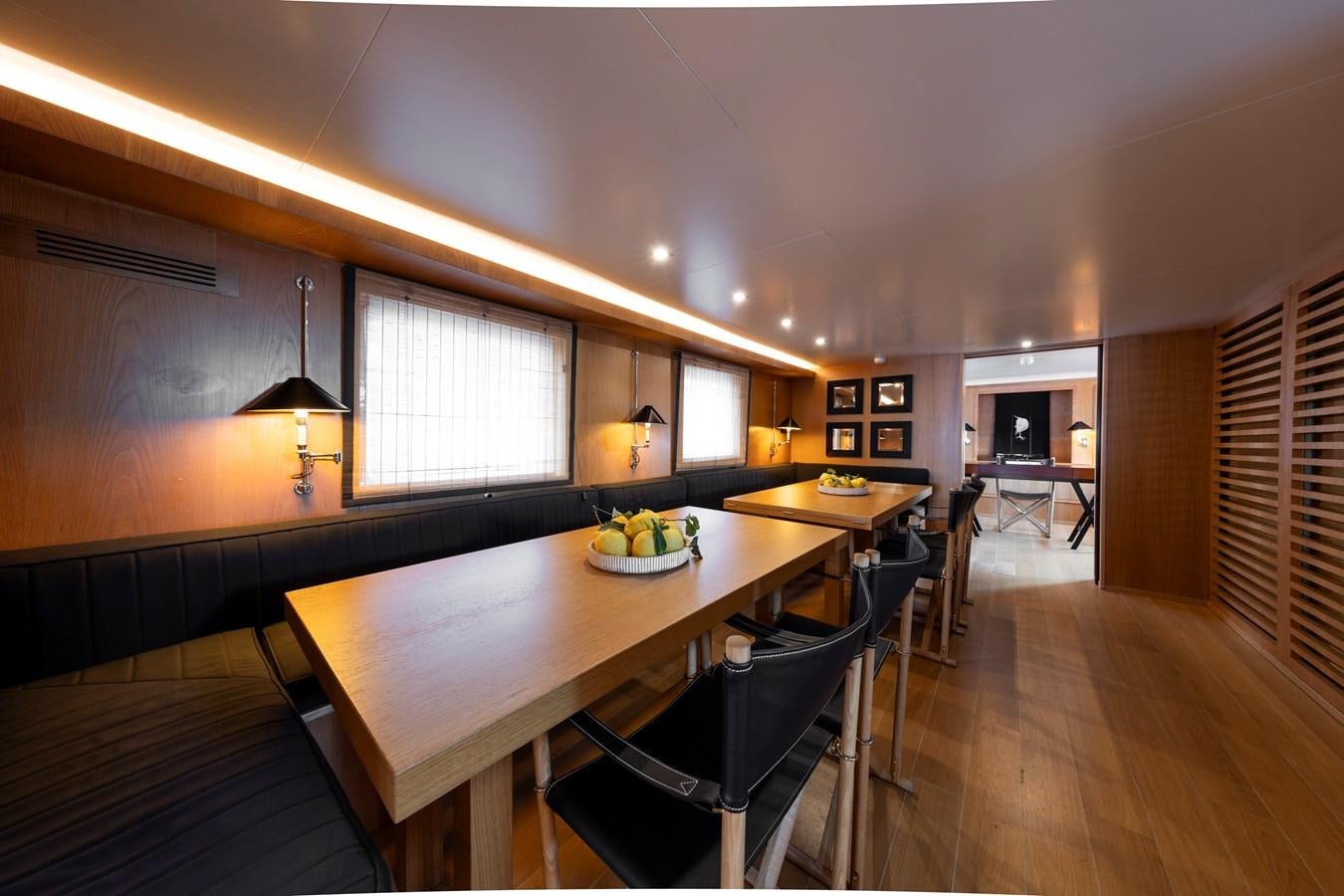 a dining room with a table and chairs aboard SOUNION II Yacht for Sale