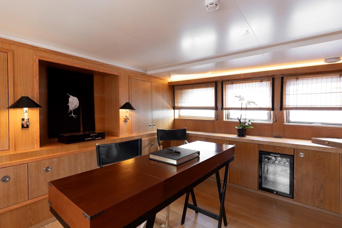 a room with a desk and a chair aboard SOUNION II Yacht for Sale