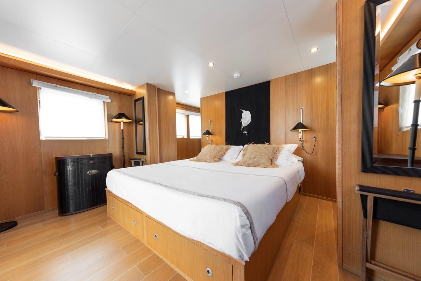 a bedroom with a large bed aboard SOUNION II Yacht for Sale