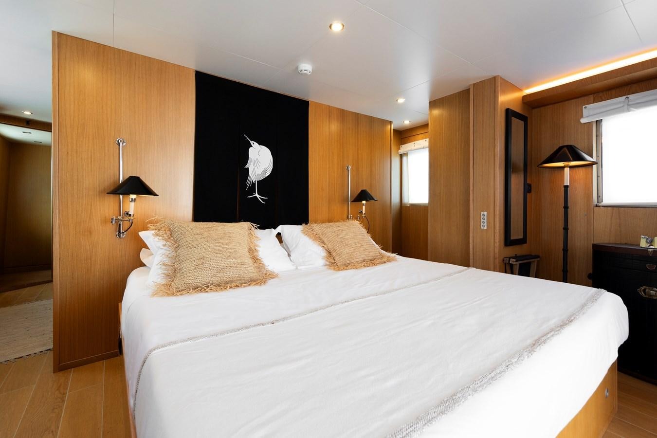 a bedroom with a large bed aboard SOUNION II Yacht for Sale