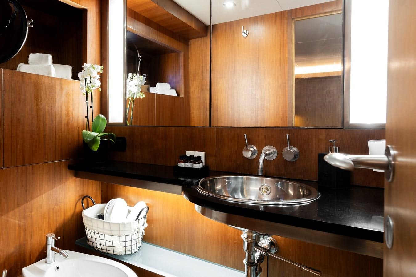 a bathroom with a sink and a mirror aboard SOUNION II Yacht for Sale