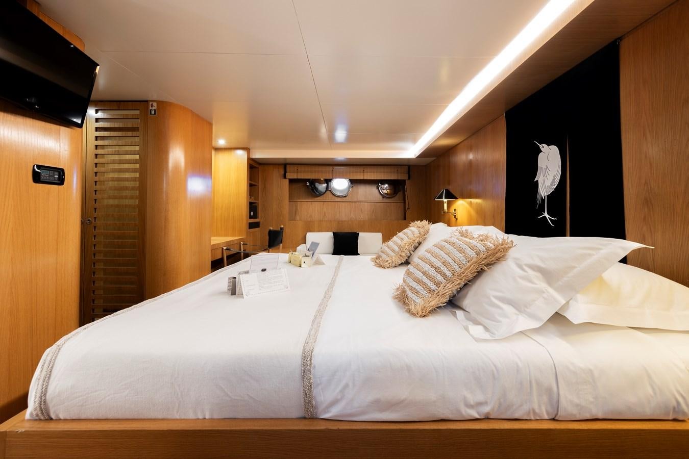 a bed with white sheets aboard SOUNION II Yacht for Sale
