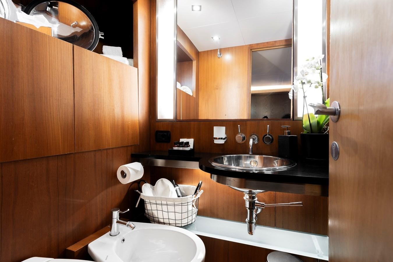 a bathroom with a sink and a mirror aboard SOUNION II Yacht for Sale