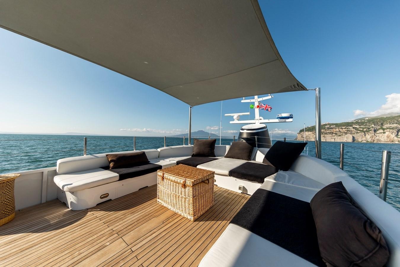 a room with a bed and a table and chairs aboard SOUNION II Yacht for Sale