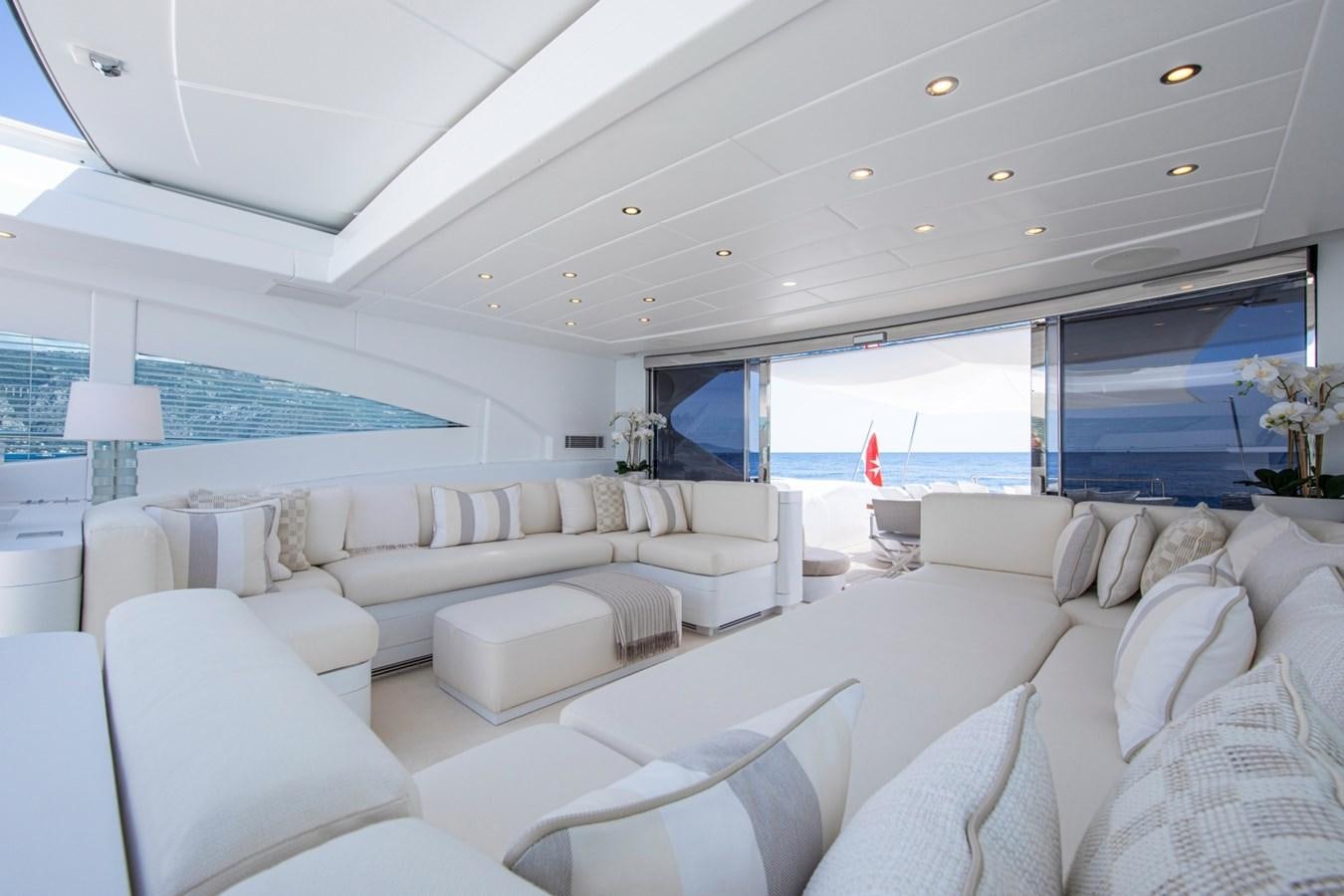 a living room with a large window aboard DAYBOAT Yacht for Sale