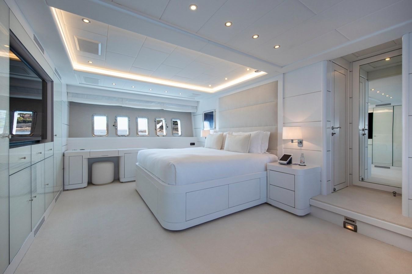 a room with a bed and a desk aboard DAYBOAT Yacht for Sale