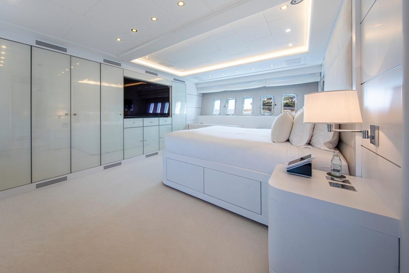 a room with a bed and a desk aboard DAYBOAT Yacht for Sale