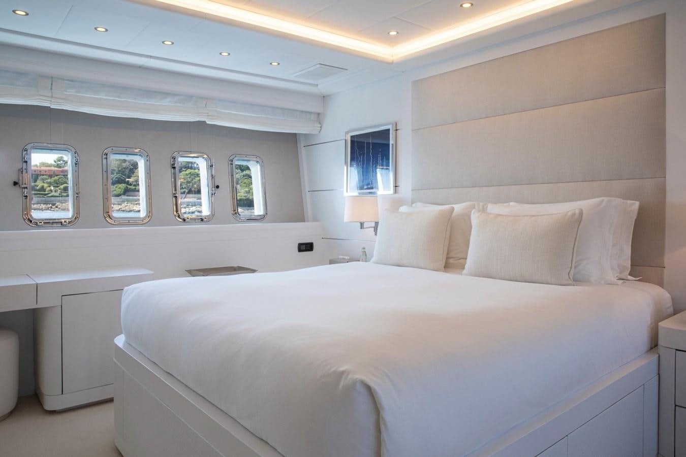 a large white bed with a white pillow and a white bed spread aboard DAYBOAT Yacht for Sale