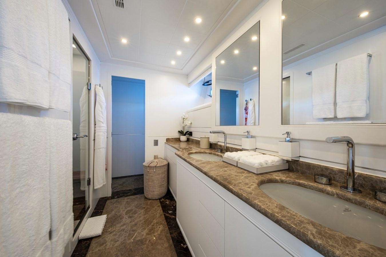 a bathroom with a countertop sink and mirror aboard DAYBOAT Yacht for Sale