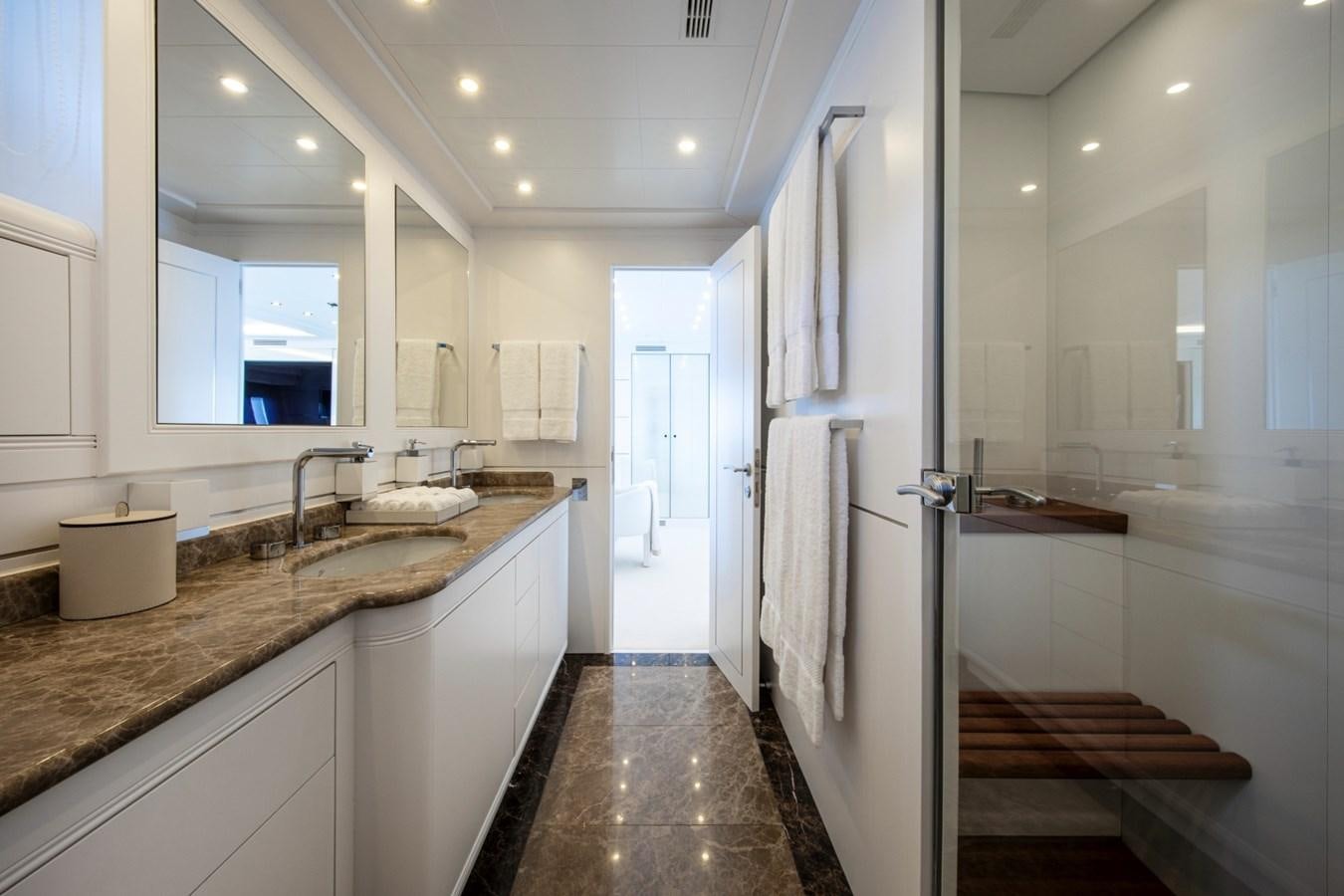 a bathroom with a marble countertop aboard DAYBOAT Yacht for Sale