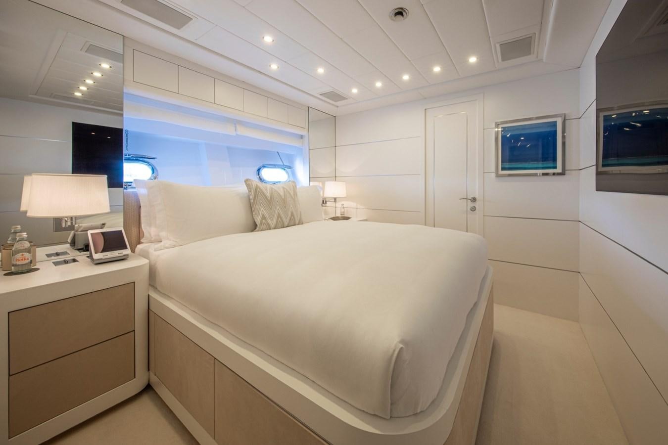 a room with a bed and a desk aboard DAYBOAT Yacht for Sale