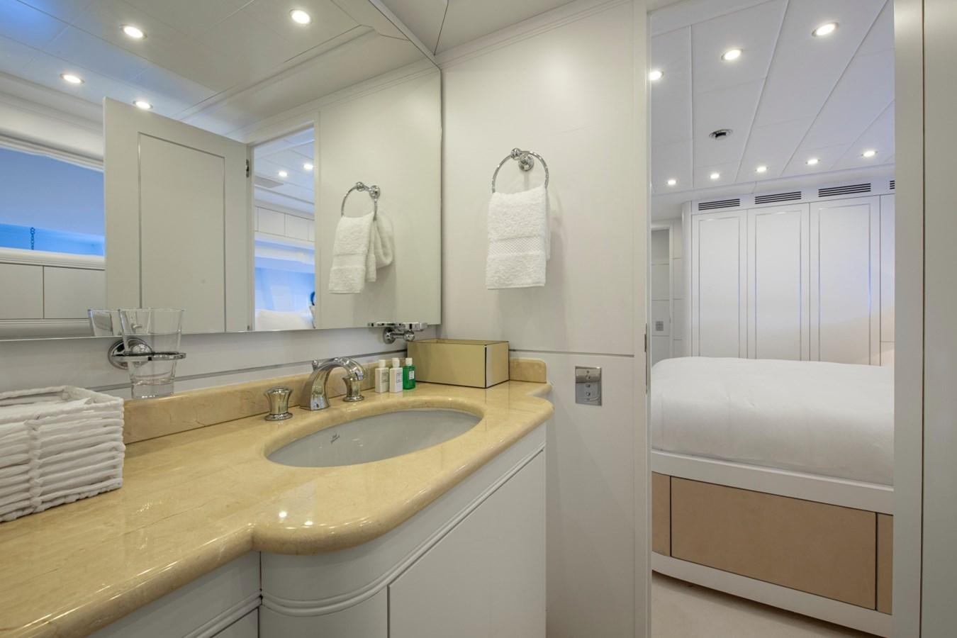 a bathroom with a sink and a mirror aboard DAYBOAT Yacht for Sale