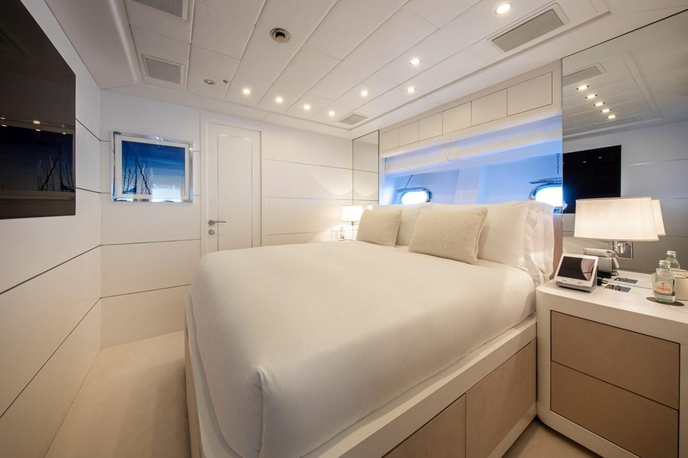 a room with a bed and a desk aboard DAYBOAT Yacht for Sale
