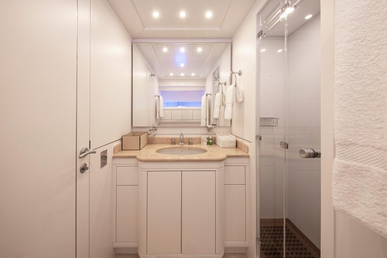a bathroom with a sink and shower aboard DAYBOAT Yacht for Sale
