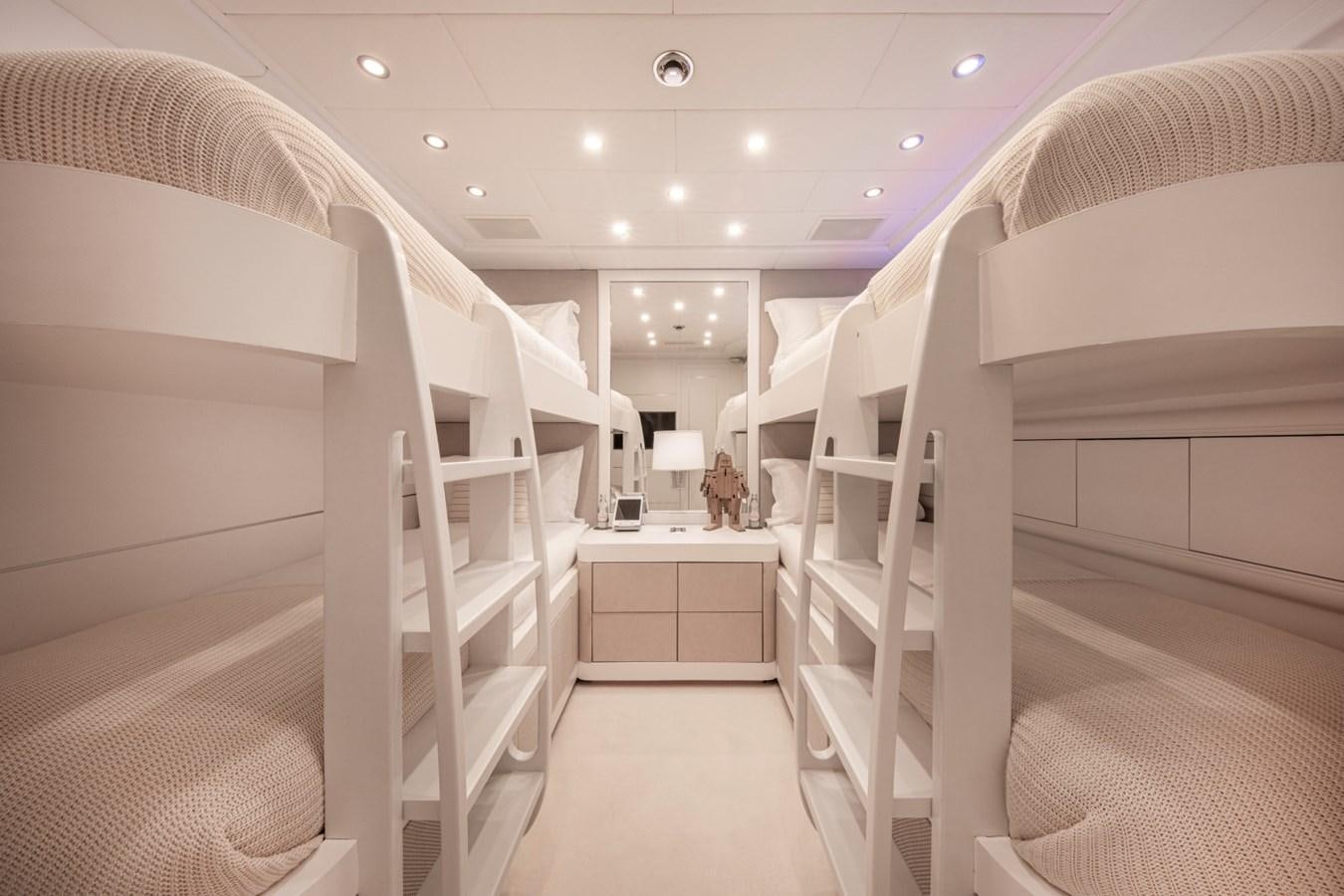 a white room with a white staircase aboard DAYBOAT Yacht for Sale