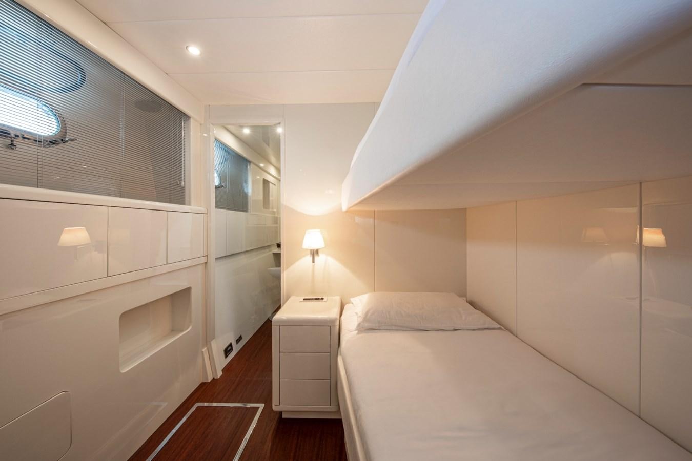 a room with two beds aboard DAYBOAT Yacht for Sale