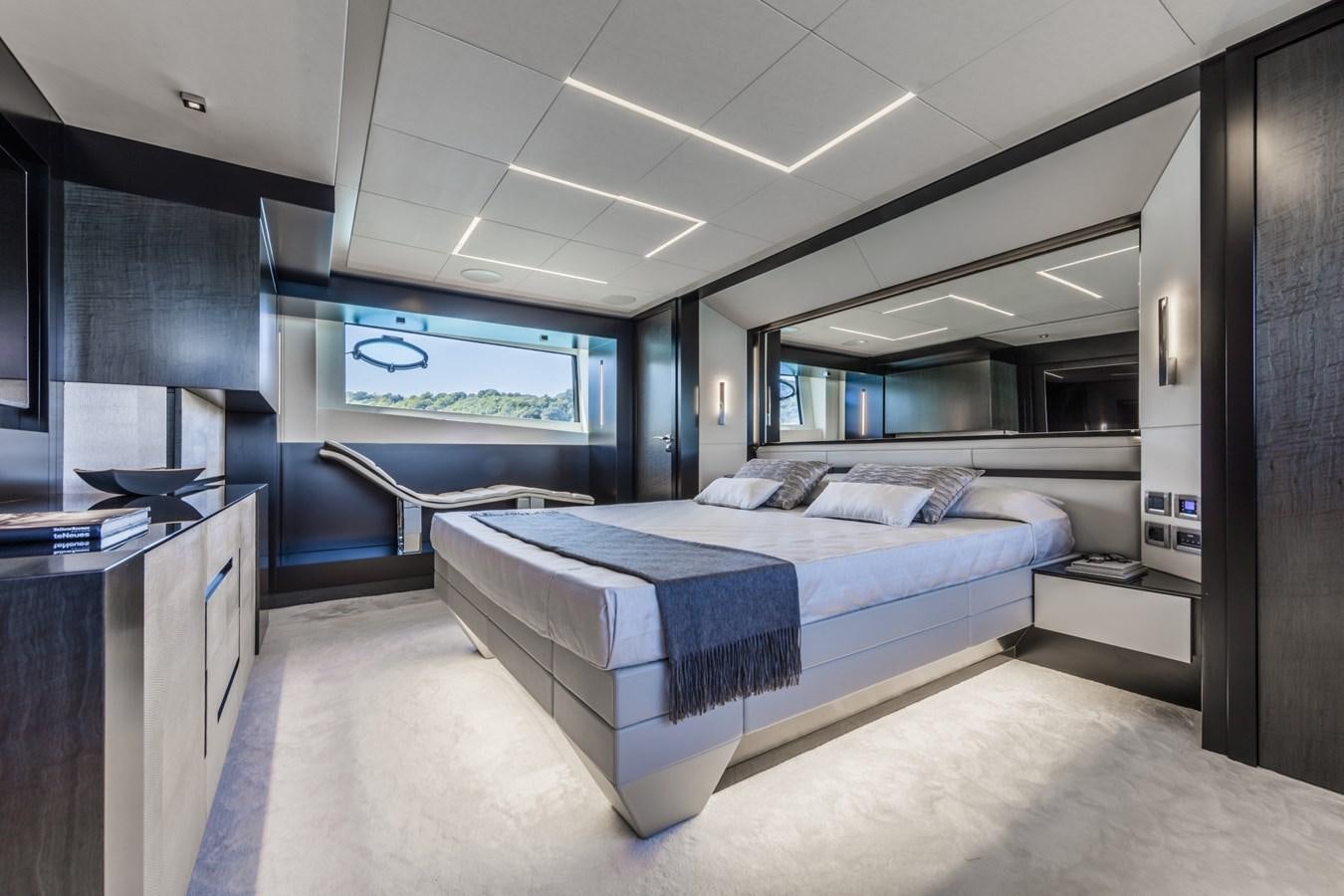 a large bedroom with a large bed aboard EL MACANN Yacht for Sale