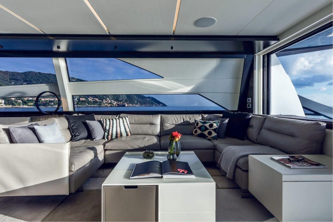 a living room with a large window aboard EL MACANN Yacht for Sale