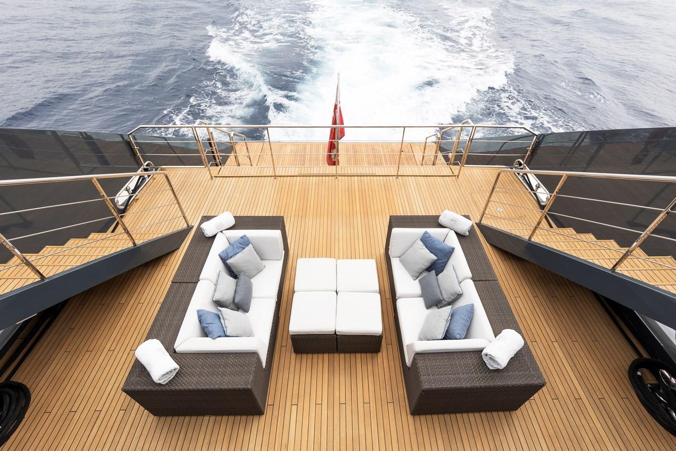 a deck with chairs on it and a body of water in the background aboard OCEAN PEARL - FRACTIONAL OWNERSHIP VESSEL Yacht for Sale