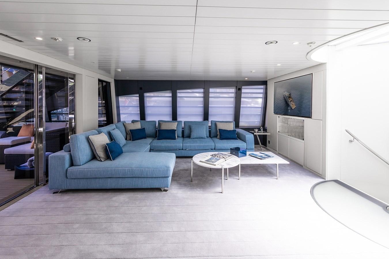 a room with a couch and a table aboard OCEAN PEARL - FRACTIONAL OWNERSHIP VESSEL Yacht for Sale