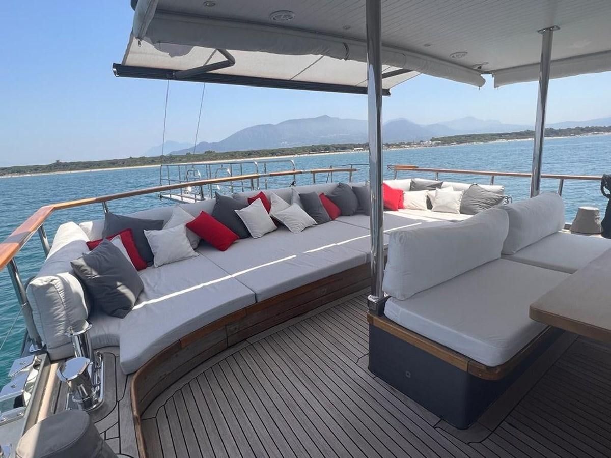 a bed on a deck aboard AYO Yacht for Sale