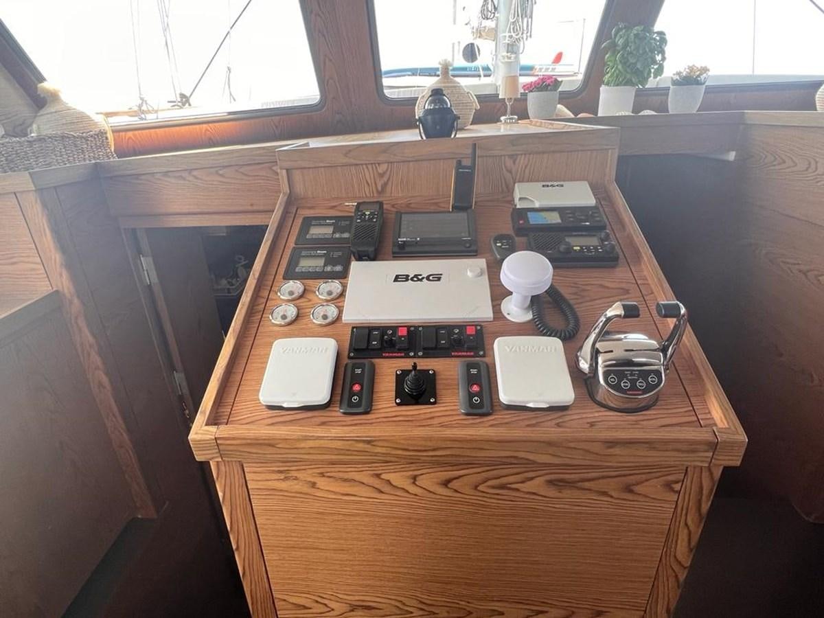 a table with electronics on it aboard AYO Yacht for Sale