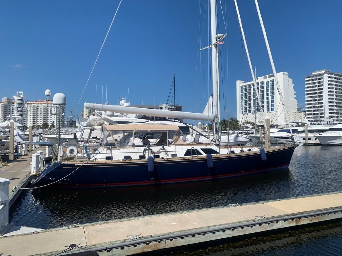 a boat docked at a pier aboard LUCKY B Yacht for Sale