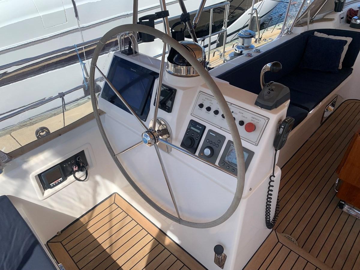 a white machine with a black handle aboard LUCKY B Yacht for Sale