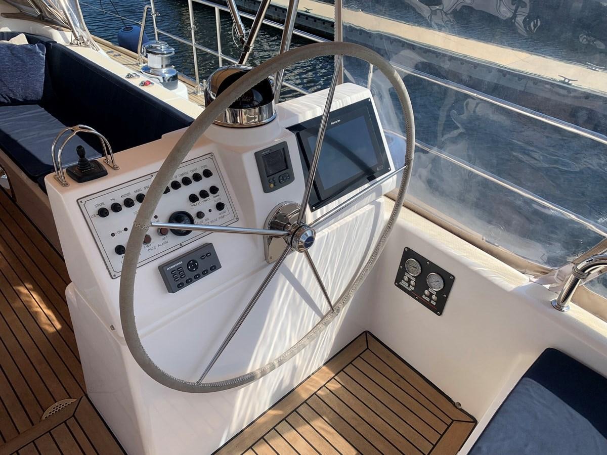 a white machine with a handle aboard LUCKY B Yacht for Sale
