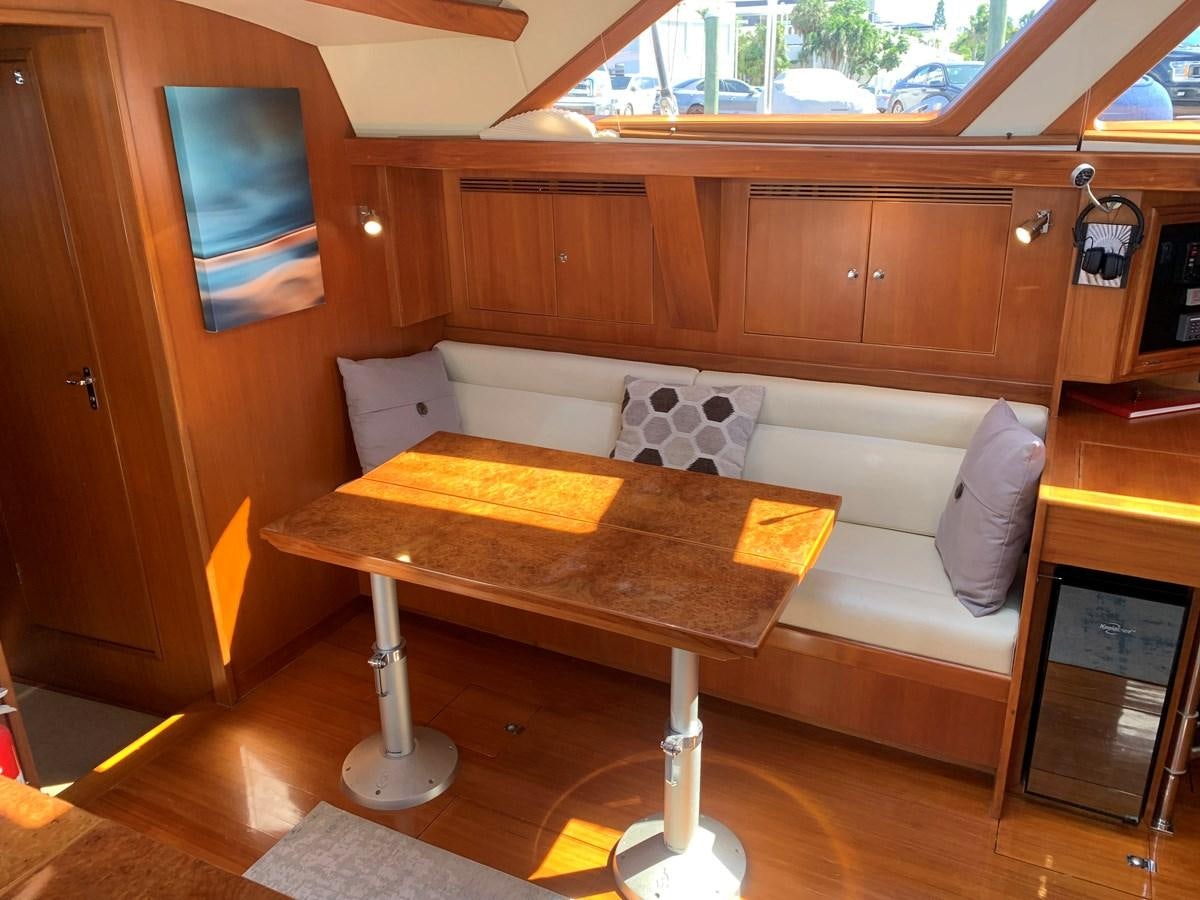 a couch in a room aboard LUCKY B Yacht for Sale