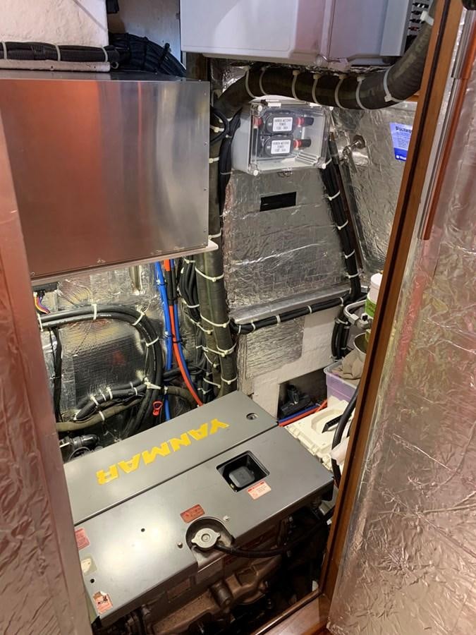 a machine with a large metal cylinder aboard LUCKY B Yacht for Sale