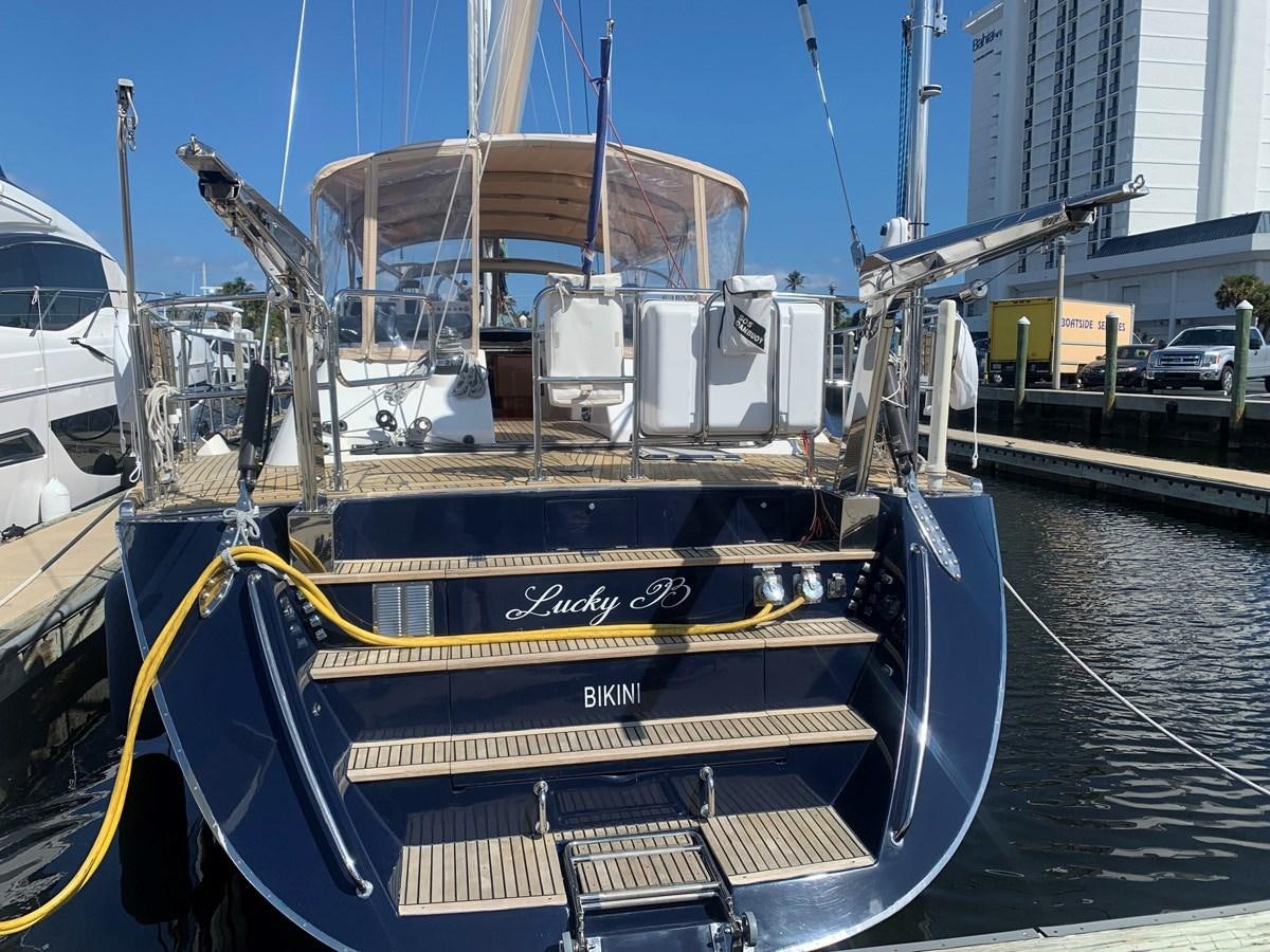 a boat docked at a pier aboard LUCKY B Yacht for Sale