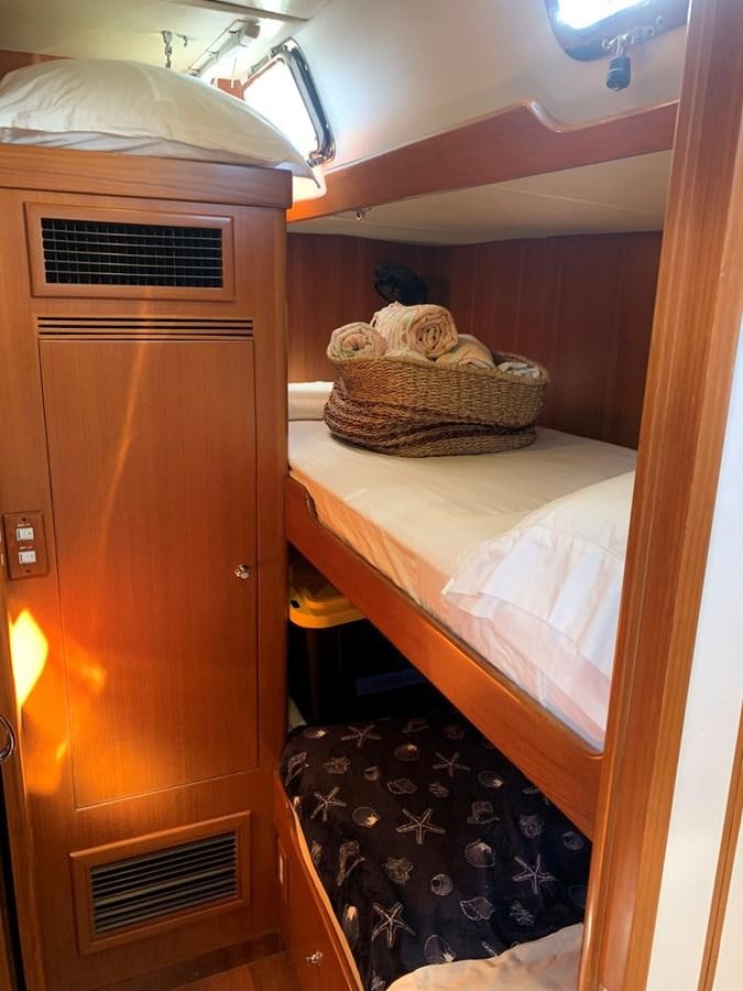 a dresser in a room aboard LUCKY B Yacht for Sale