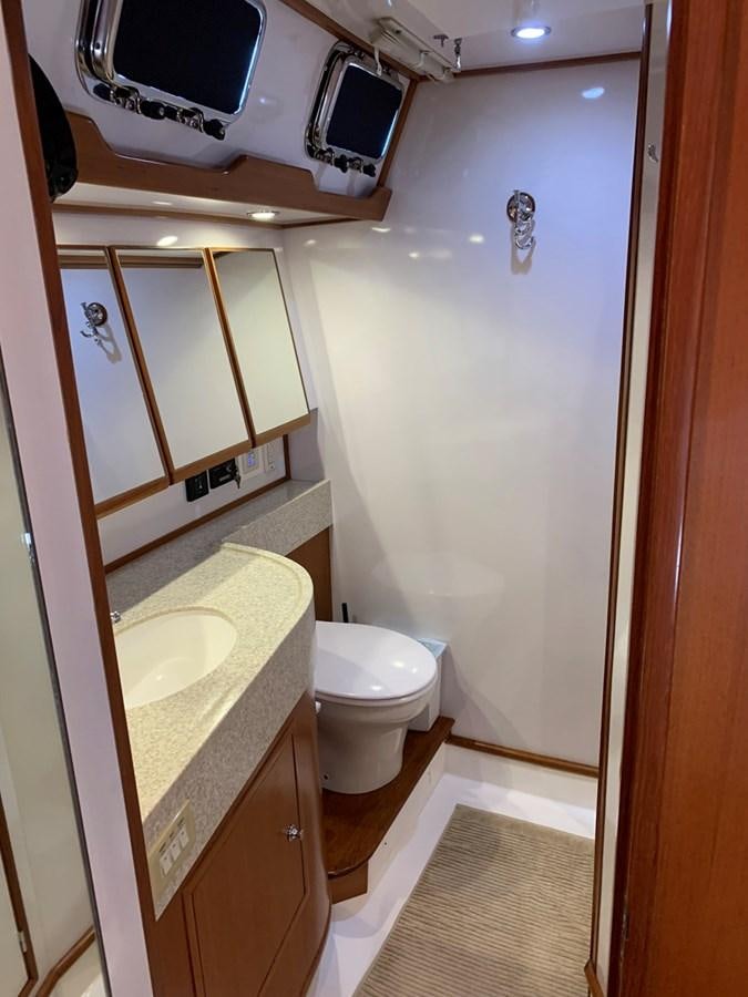 a bathroom with a sink and a toilet aboard LUCKY B Yacht for Sale