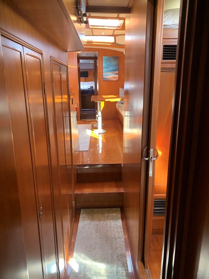 a hallway with a glass door aboard LUCKY B Yacht for Sale