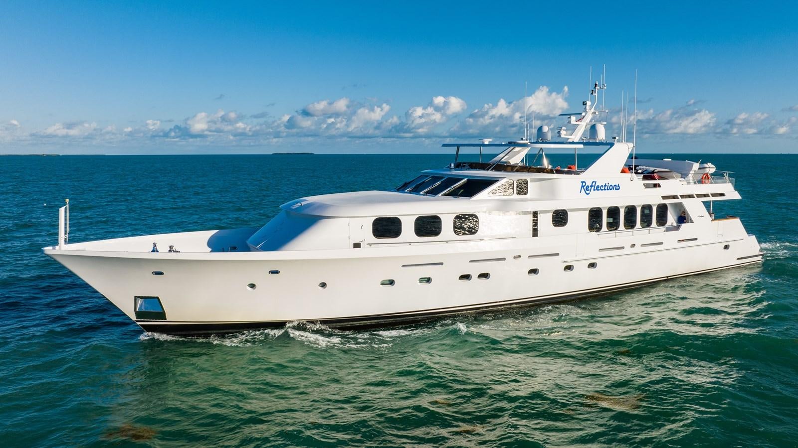 a white boat in the water aboard SEAQUEST Yacht for Sale