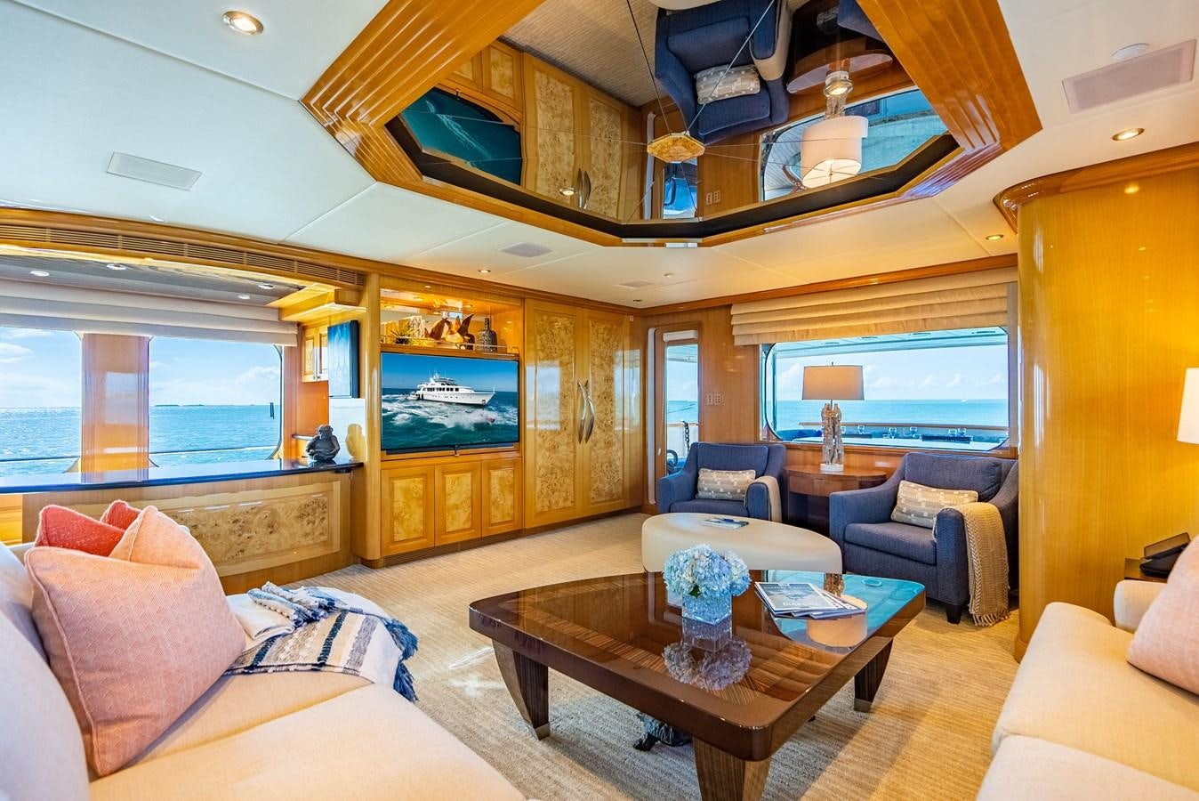 a living room with a large window aboard SEAQUEST Yacht for Sale