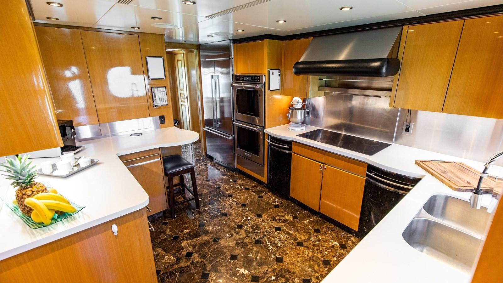 a kitchen with a marble counter top aboard SEAQUEST Yacht for Sale